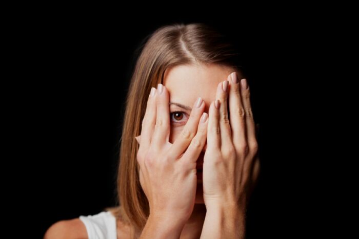 woman embarrassed by her IBS stomach noises