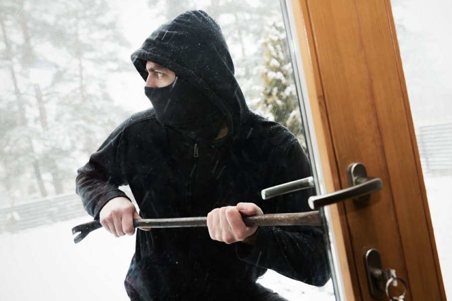 Harpaxophobia Therapy in Wolverhampton, West Midlands - masked burglar breaking in with crowbar