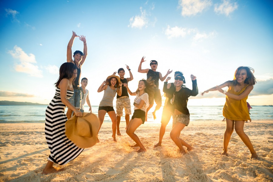 cherophobia therapy wolverhampton - fear of happiness - happy group of young people on beach