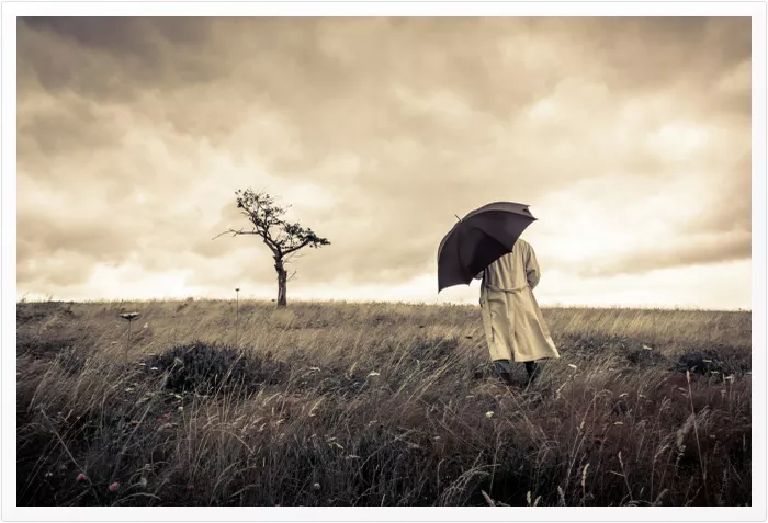 Man with SAD walking in a wintry field