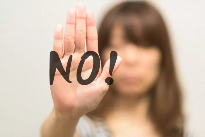 womans body saying 'NO' metaphor
